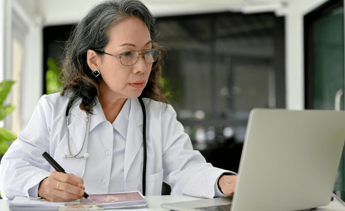 Doctor using laptop